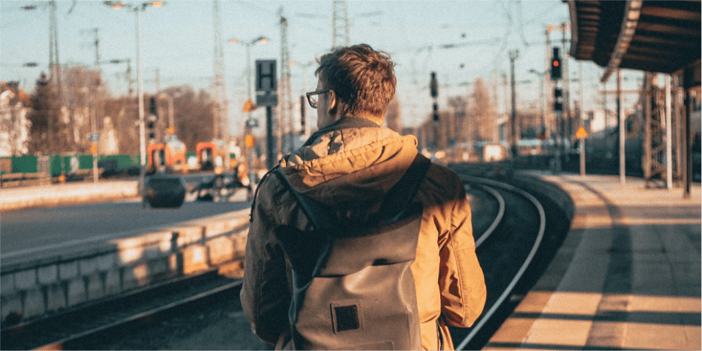 lone traveller on a deserted railway station